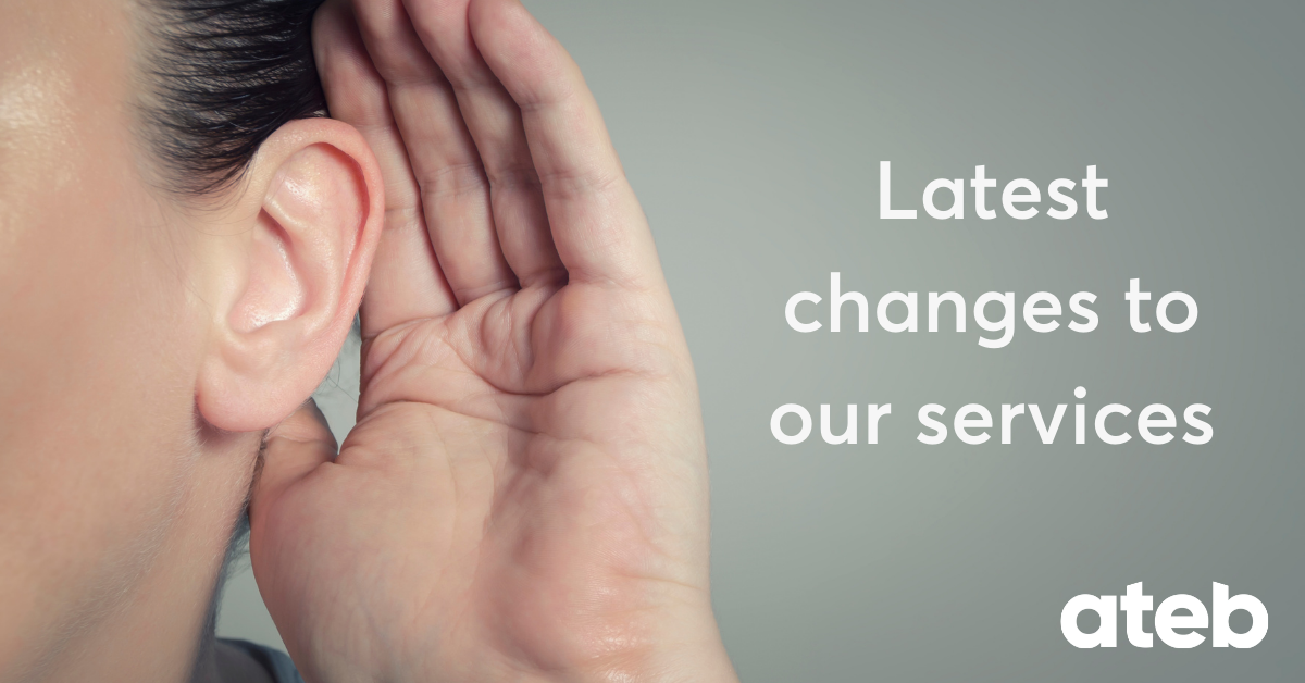 Woman cupping hand to ear listening